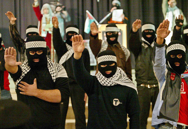 Members of the Fatah youth movement chant slogans during a rally for Palestinian presidential candidate Mahmoud Abbas at a hotel in the Jerusalem suburb of Beit Hanina, January 5, 2005. Palestinian fighters wounded 12 soldiers in a rocket attack on Israel Wednesday, defying calls for a cease-fire from Mahmoud Abbas, the frontrunner to succeed Yasser Arafat in an election Sunday. REUTERS/Ammar Awad